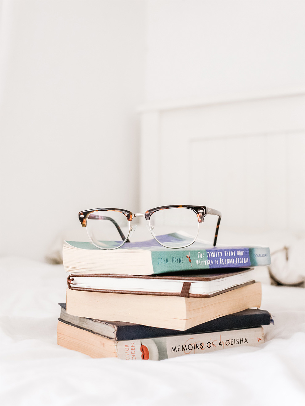 Glasses on Stack of Books